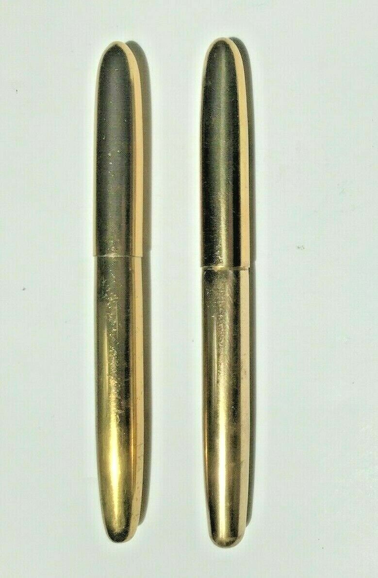 Pair of unbranded brass fountain pens one early cartridge one traditional filer
