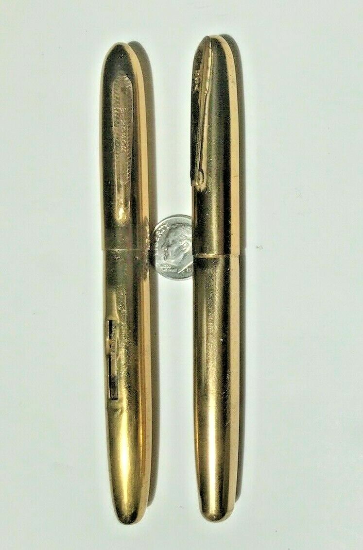 Pair of unbranded brass fountain pens one early cartridge one traditional filer